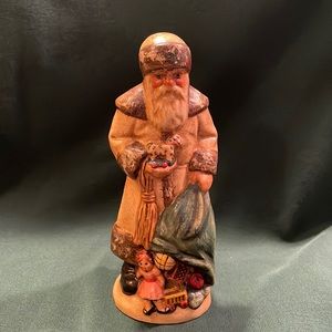 Vaillancourt limited edition 1990 Father Christmas with bag of toys in white